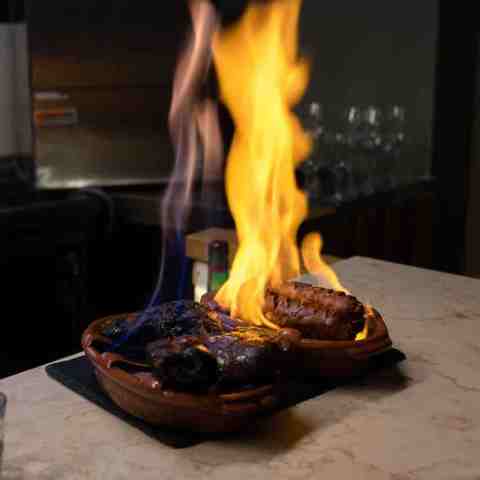 chorizo cooked in flames