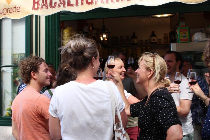 a group of people toasting with porto winw