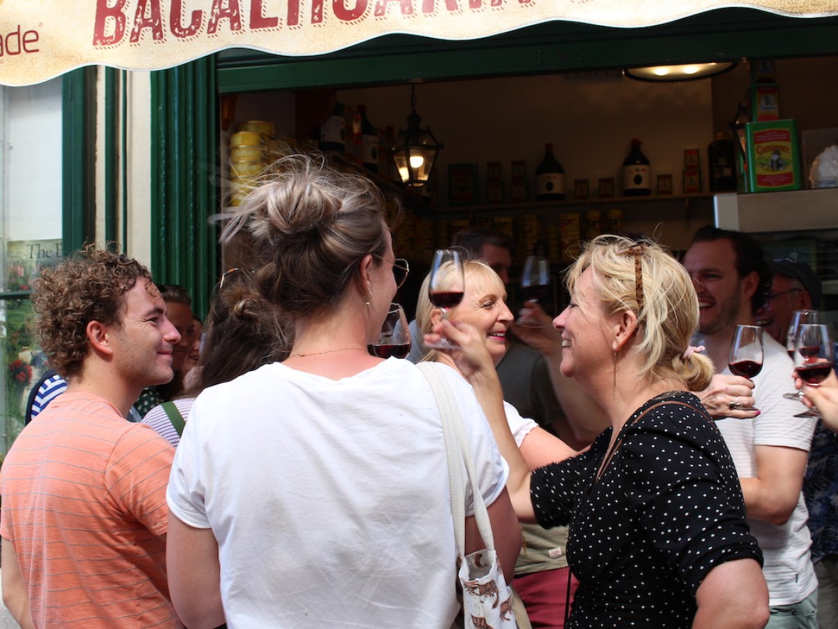a group of people drinking wine at a restaurant
