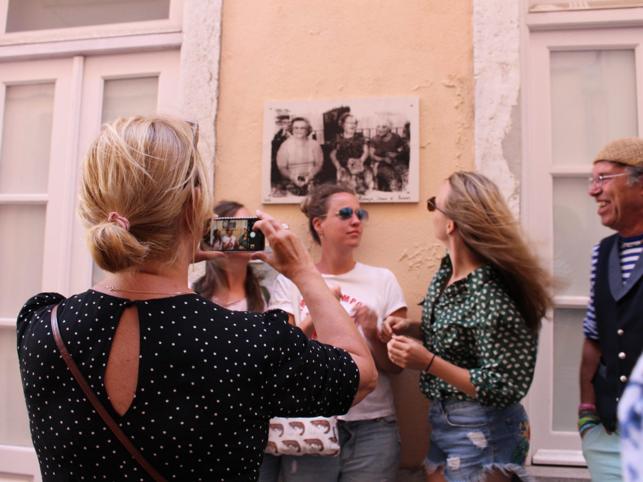 a group of people standing in front of a building