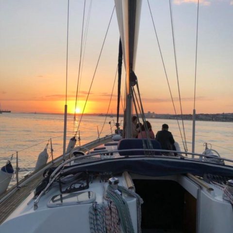 a close up of a boat next to a body of water