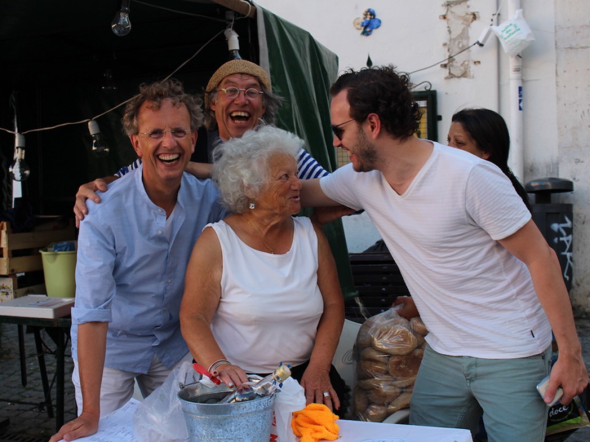 guests engaging with a local woman