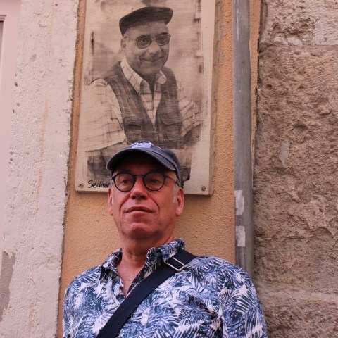 a man standing in front of a street art project