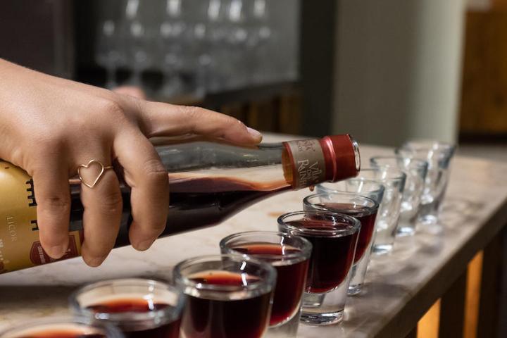 a person sitting at a table with a cup of coffee