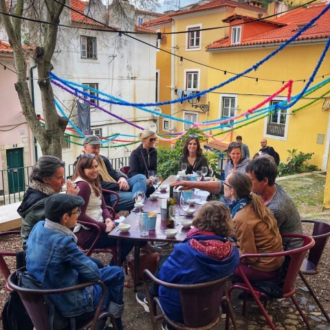 a group of people in a table outside