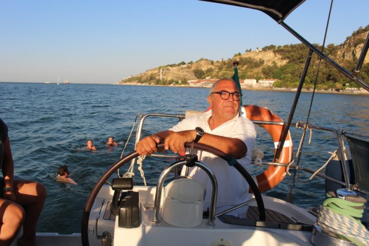a group of people in a boat on a body of water