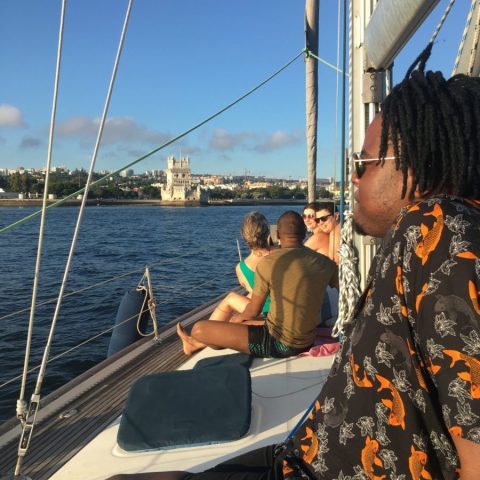 a group of people in a boat on a body of water
