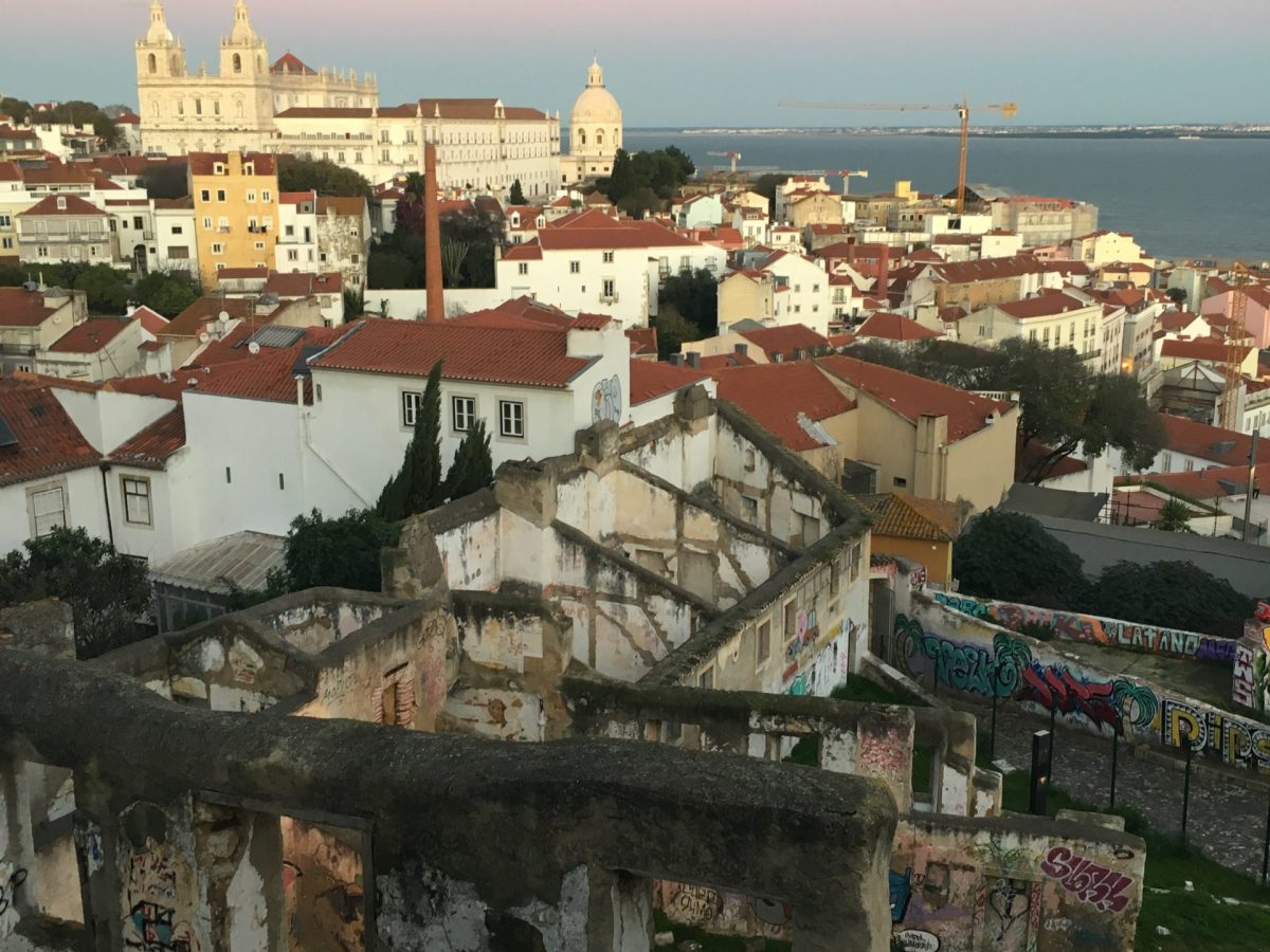 a large body of water with a city in the background