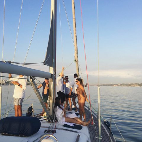a man standing on a boat in a body of water