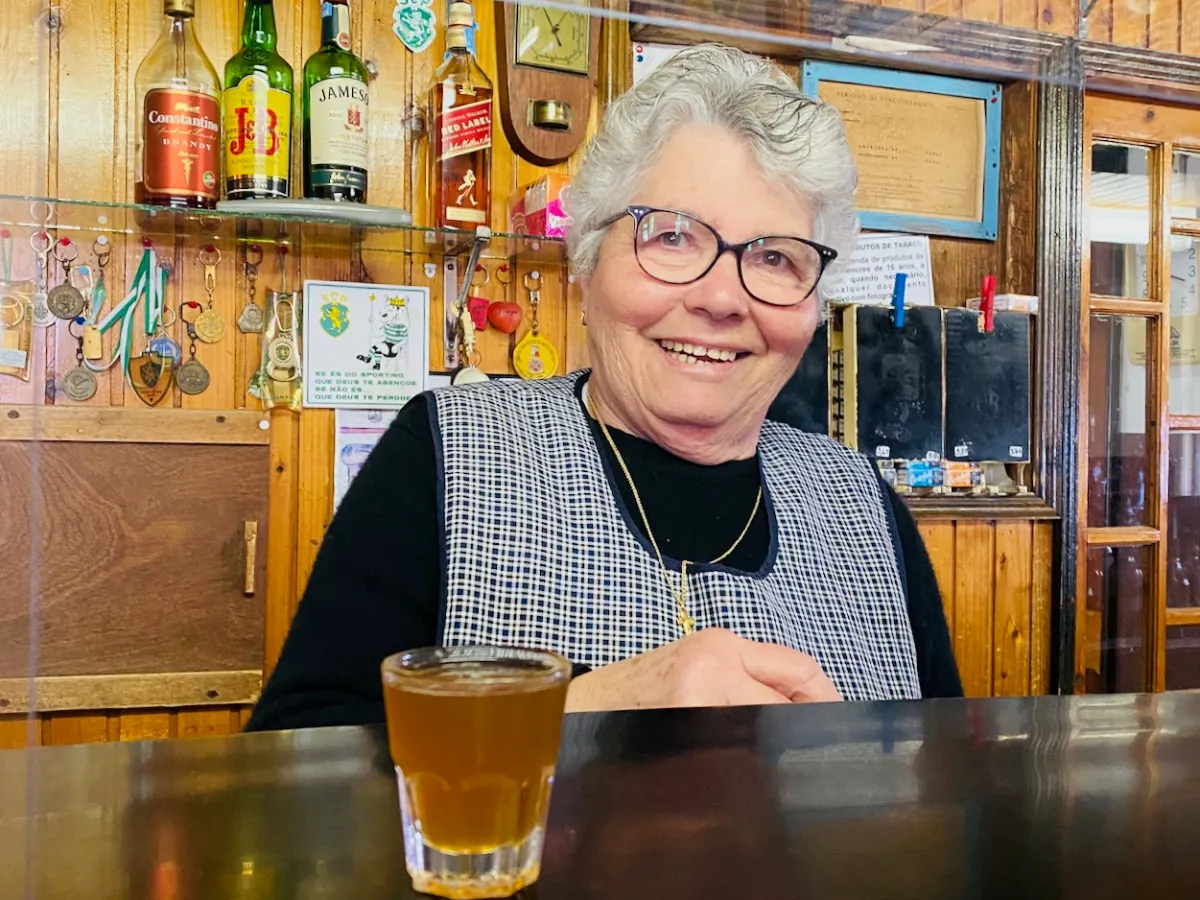 a person sitting at a table in a restaurant