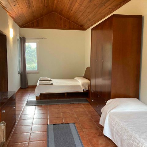 a bedroom with a bed in a room