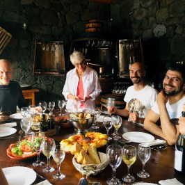 a group of people sitting at a dinner table