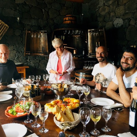 a group of people sitting at a dinner table