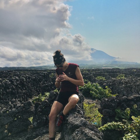 a person standing on a rocky hill
