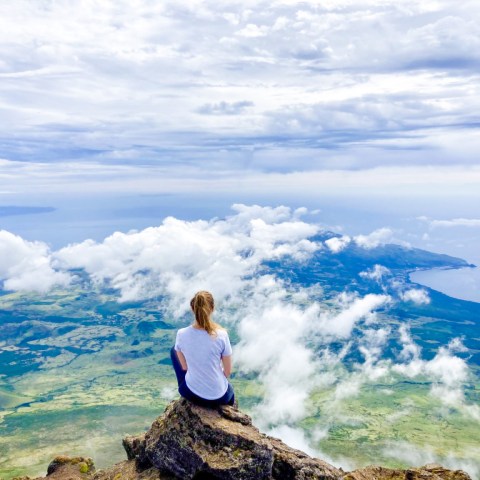 a man standing on top of a mountain