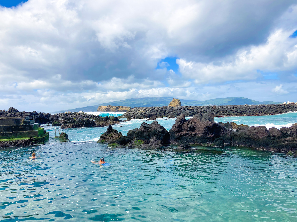 azores-itinerary-7-days a group of people swimming in a body of water