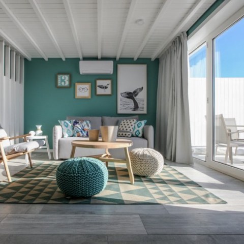 a room filled with furniture and a large window