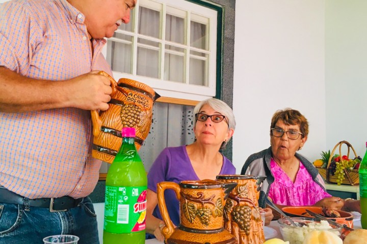 a man holding a glass of wine