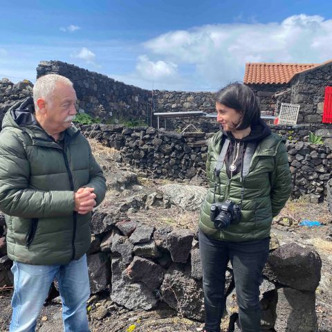 a group of people standing on a rock