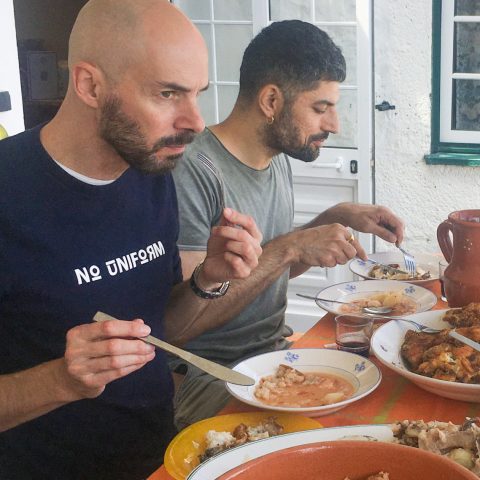 a man cooking food on a plate