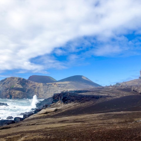 a beach with a mountain in the background