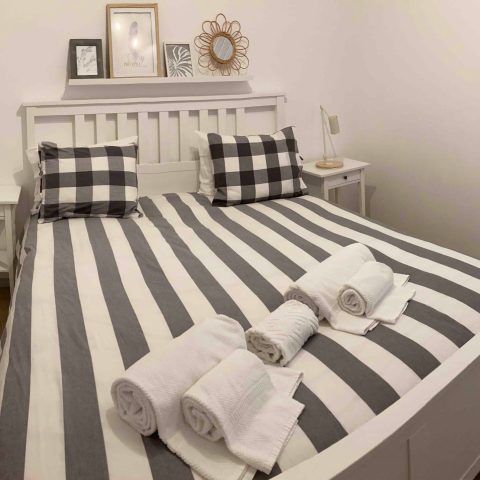 a bedroom with a bed in a room