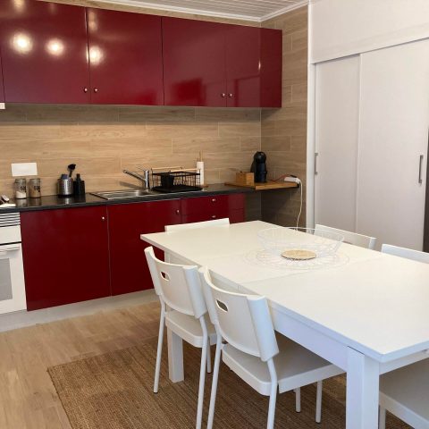 a kitchen with an island in the middle of a table