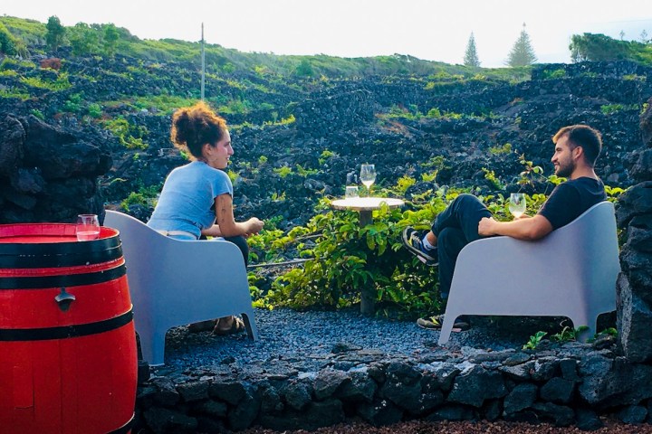 a group of people standing on top of a mountain