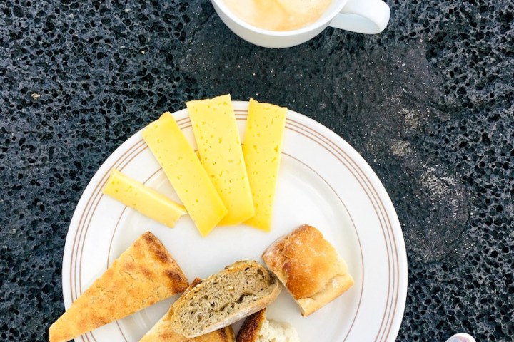 a plate of food and a cup of coffee