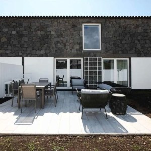 a chair sitting in front of a building