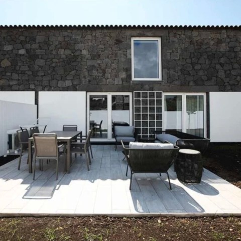 a chair sitting in front of a building