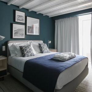 a bedroom with a large bed sitting in a room