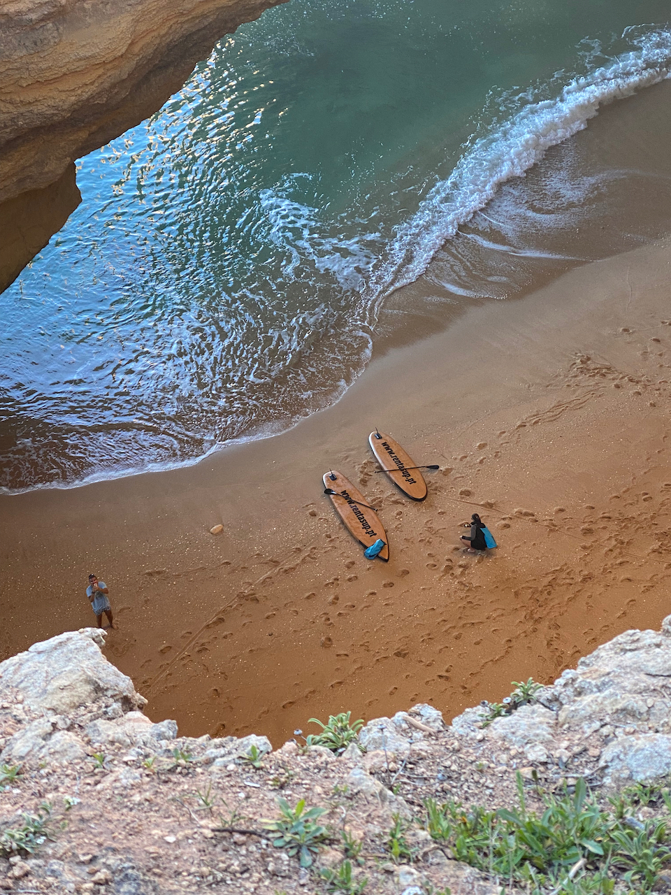 a group of people on a rocky beach