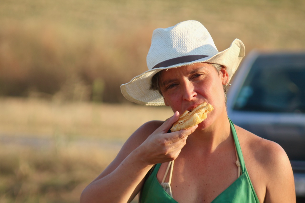a person eating a hot dog