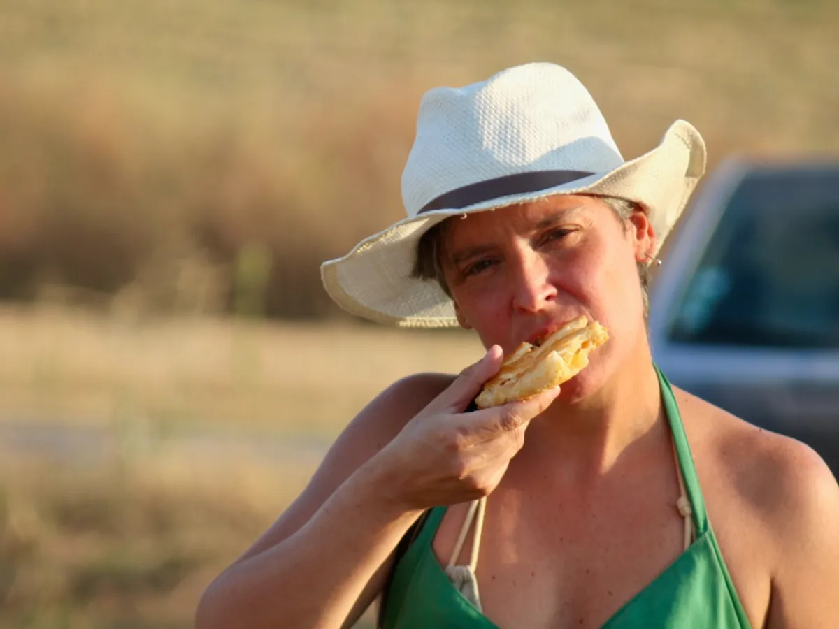 a person eating a hot dog