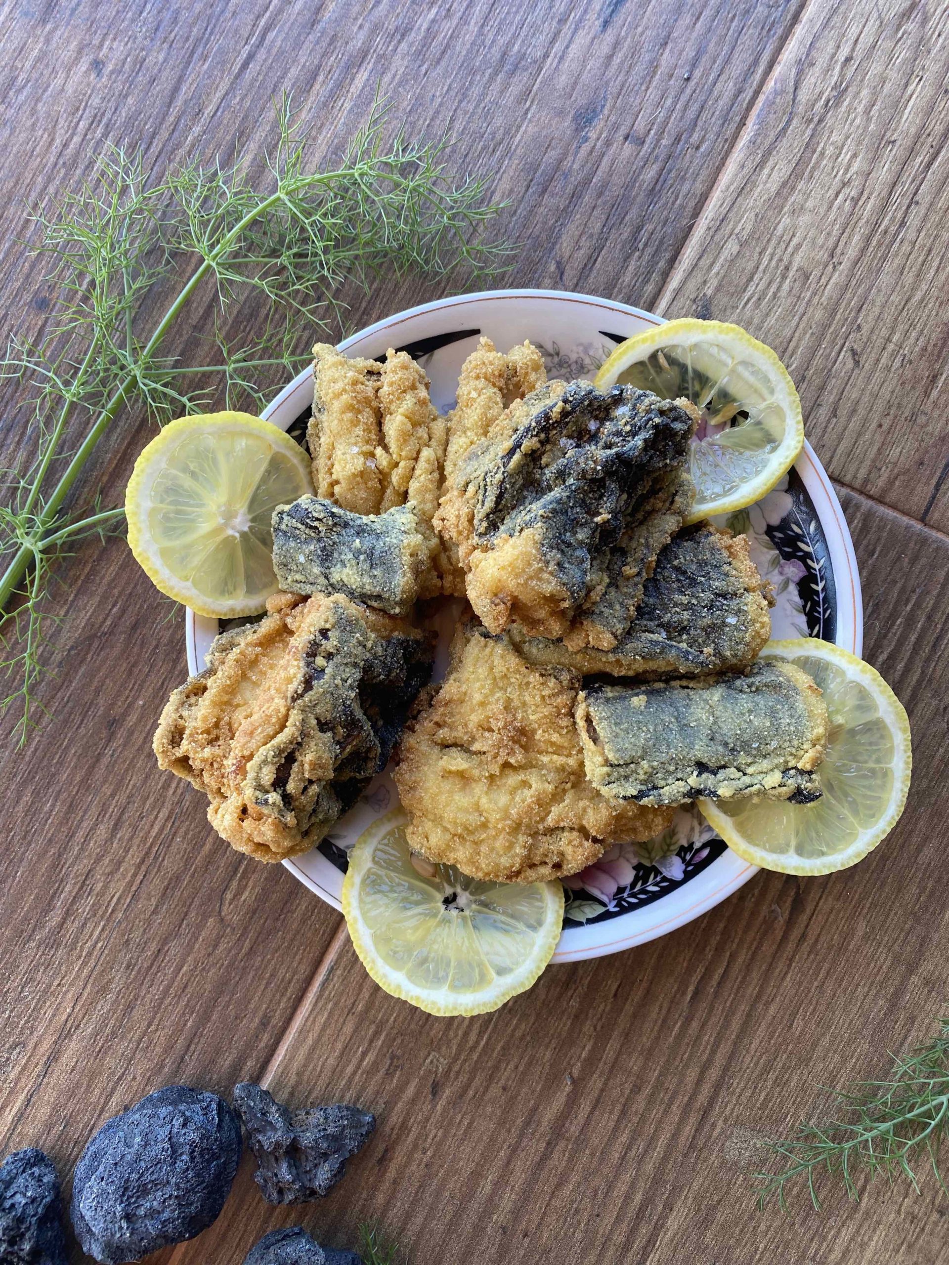 a plate of fried conger on a table