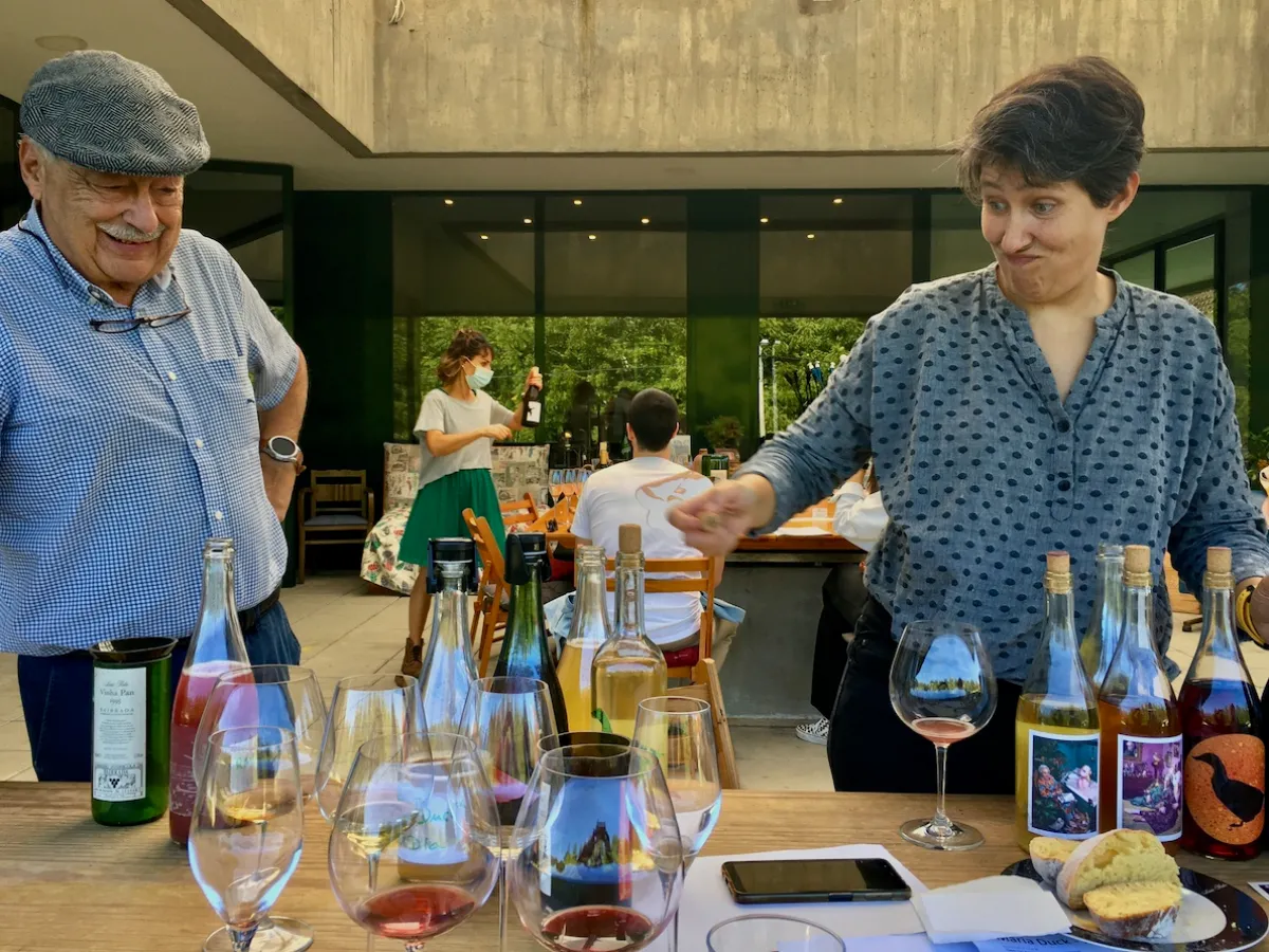 a group of people sitting at a table with wine glasses