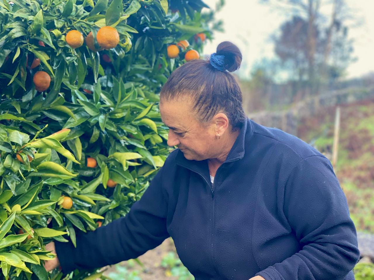 a man standing in front of a fruit