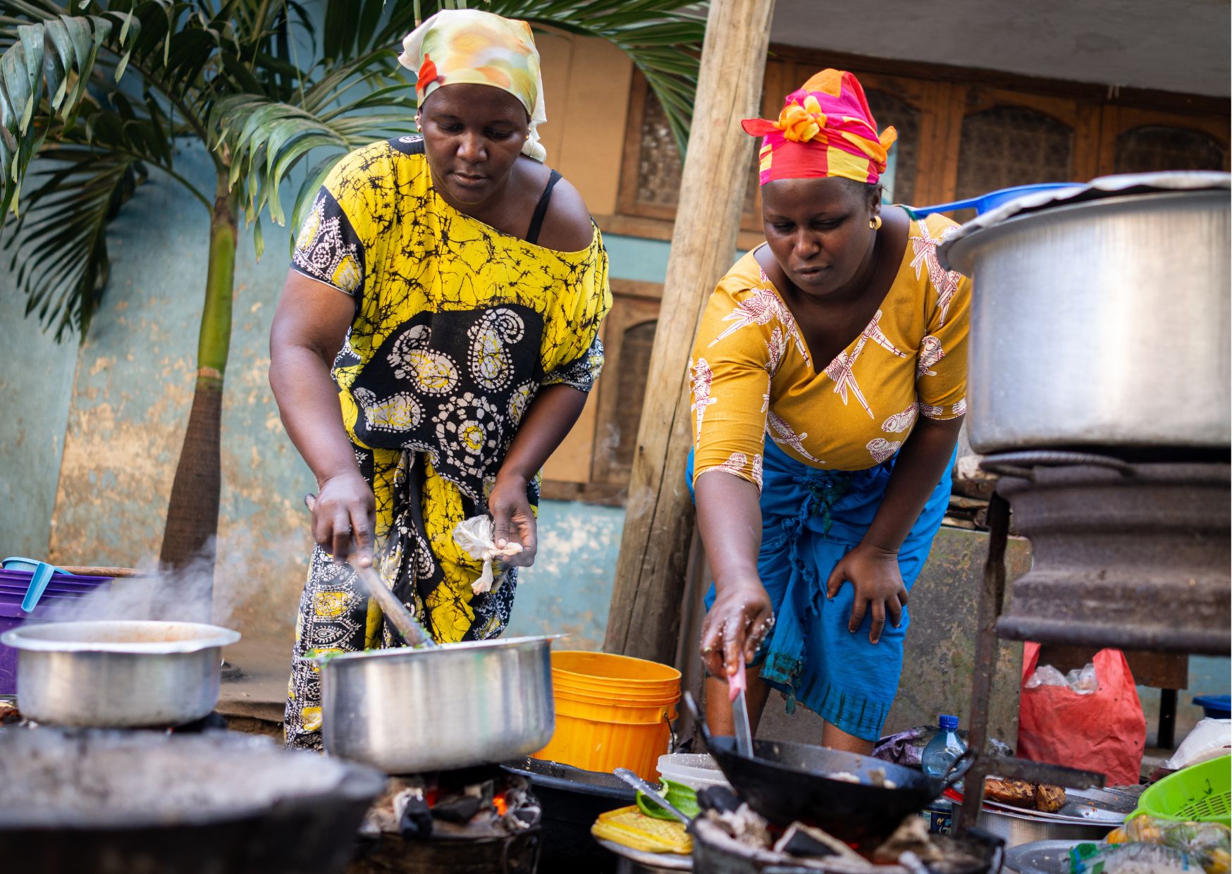 african-cuisine-lisbon a man and a woman wearing a hat
