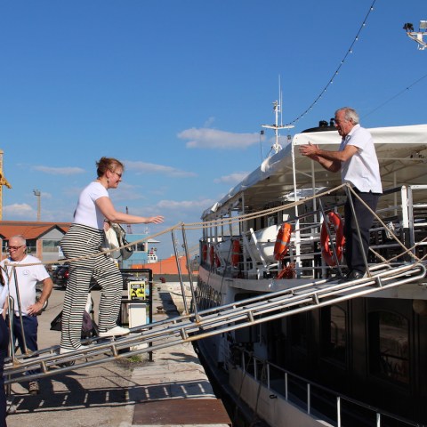 a group of people standing on a dock