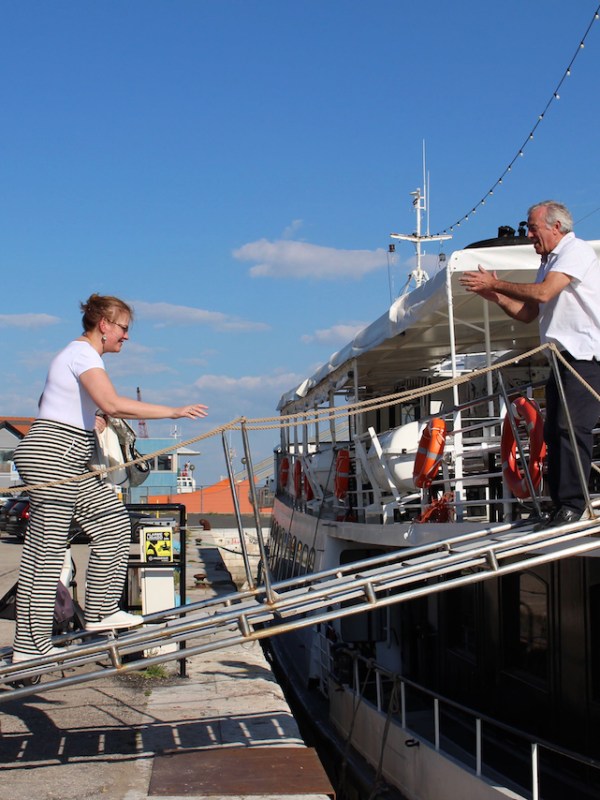 a group of people standing on a dock