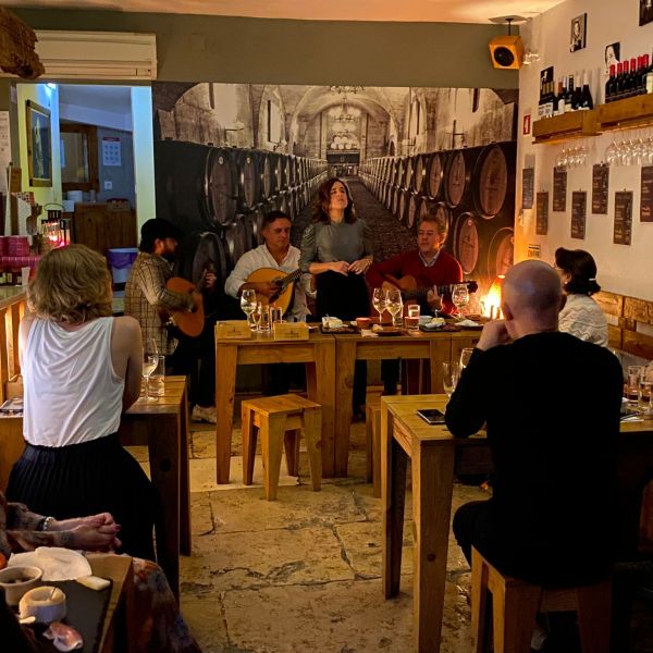 a group of people sitting at a table in a restaurant