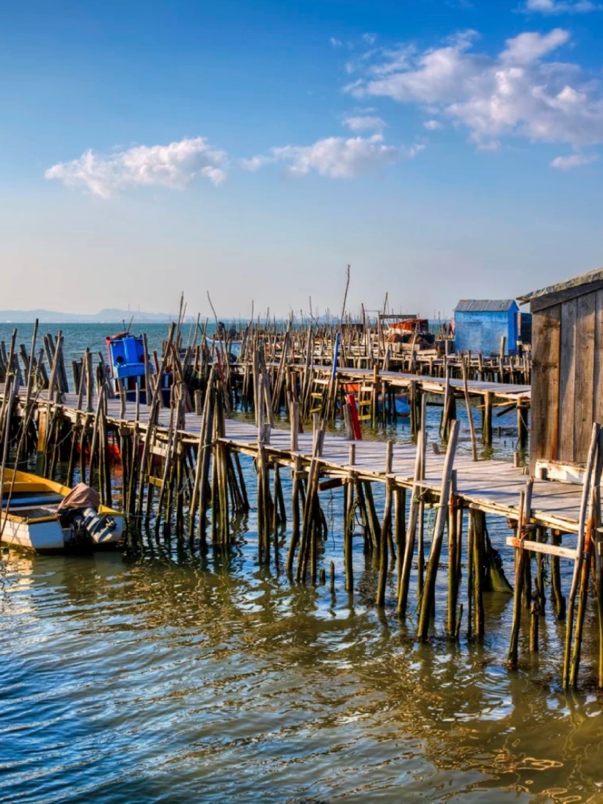 a boat is docked next to a body of water