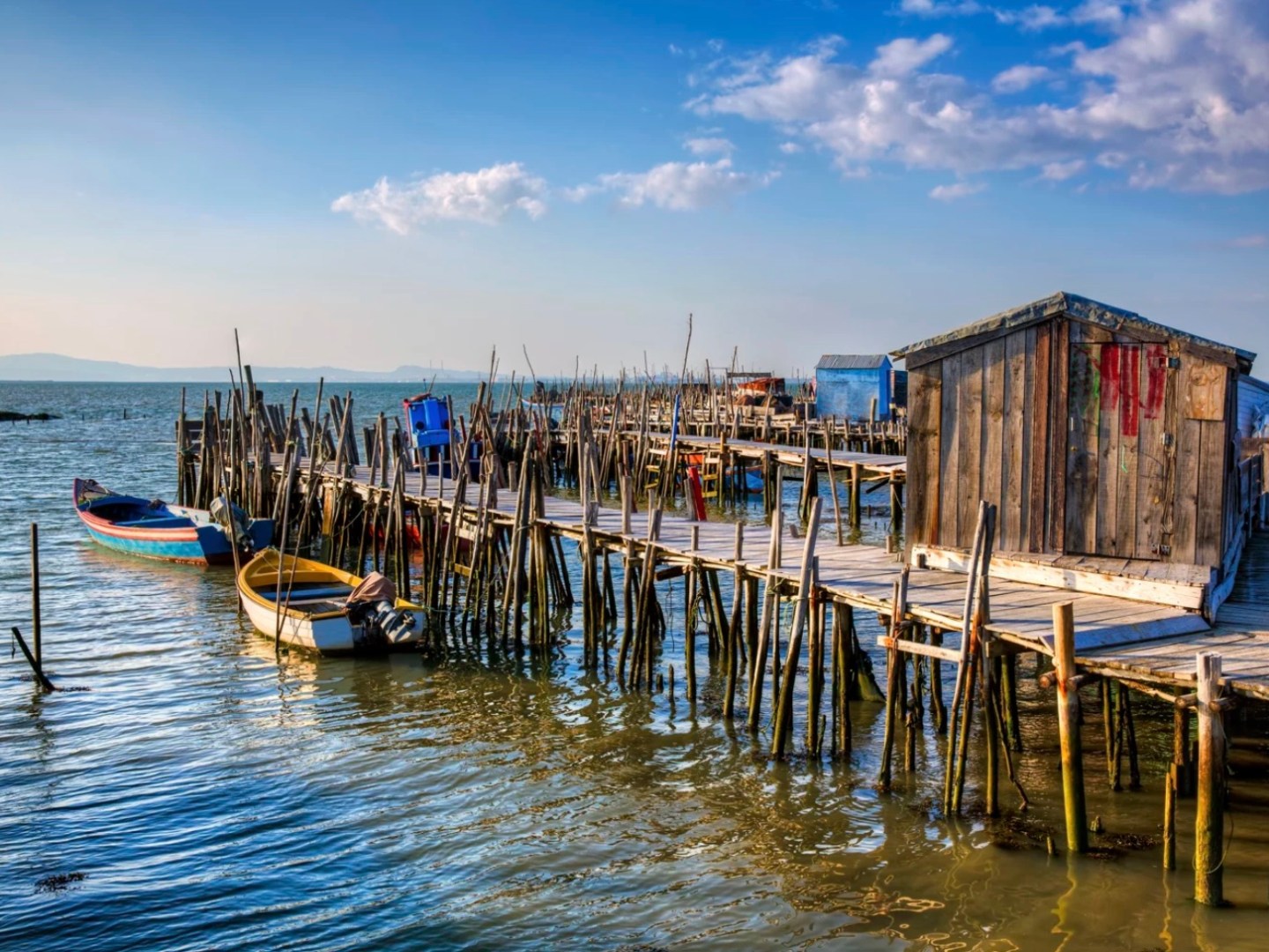 a boat is docked next to a body of water