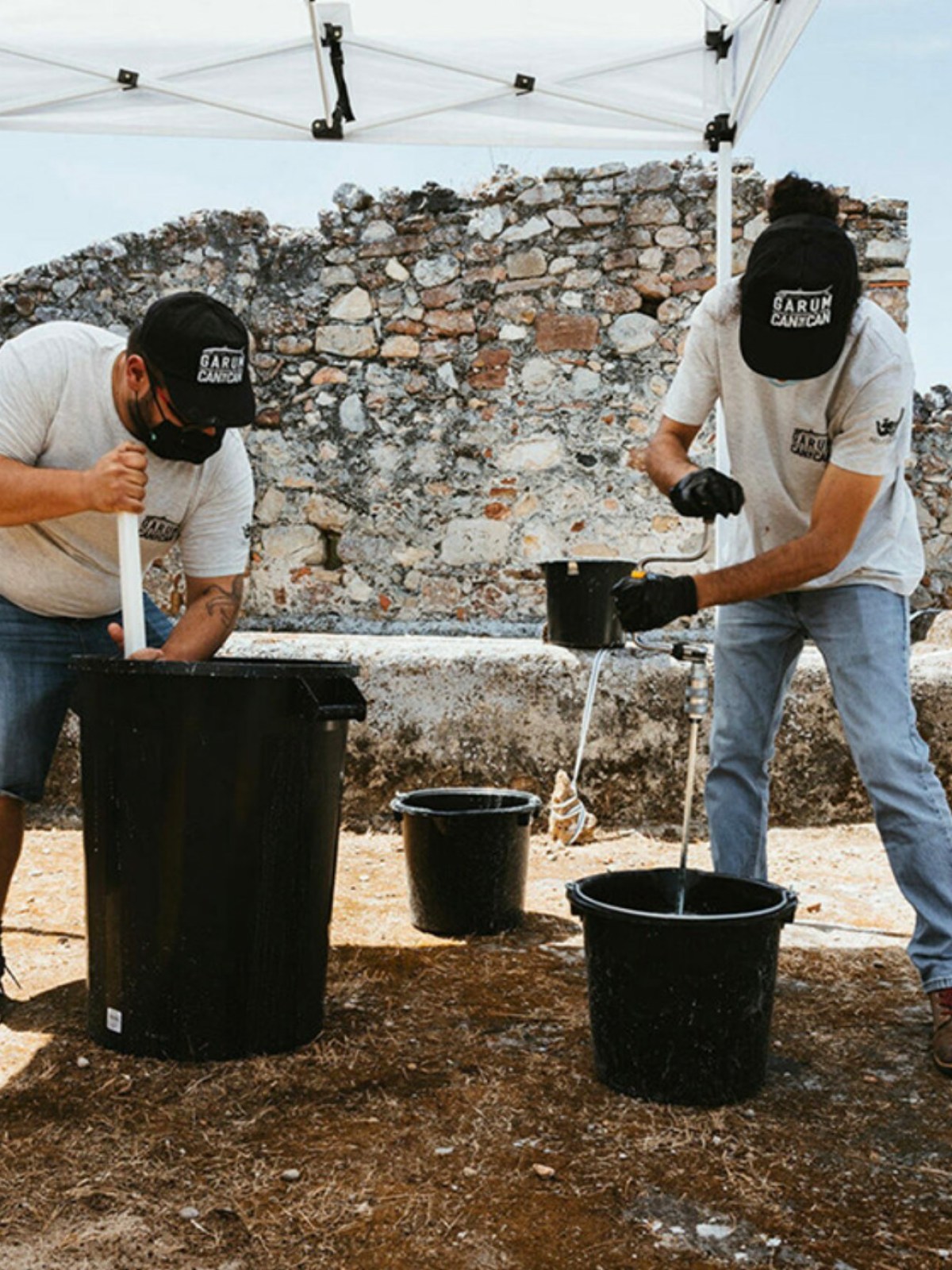 a group of people standing in a parking lot