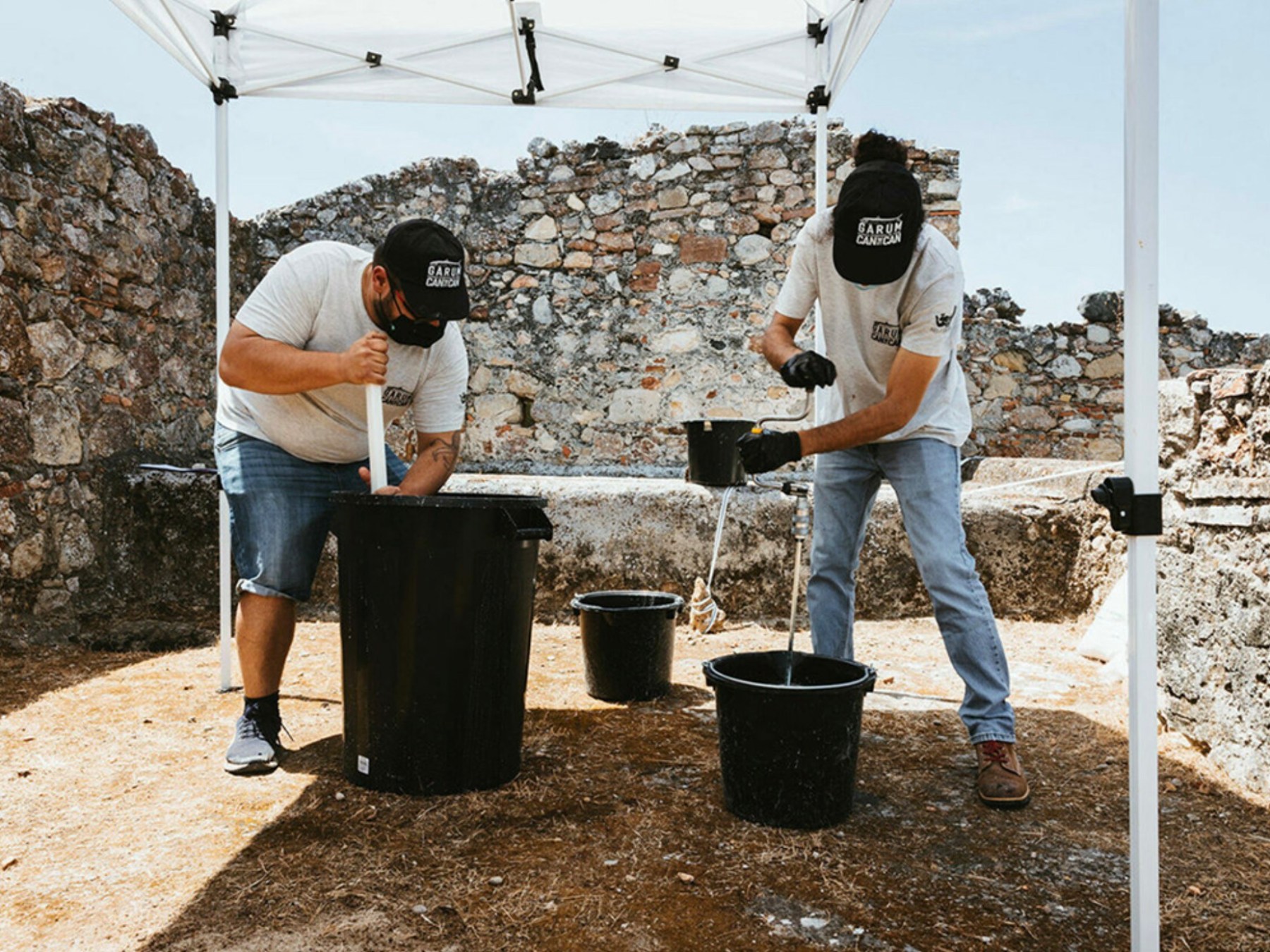 a group of people standing in a parking lot