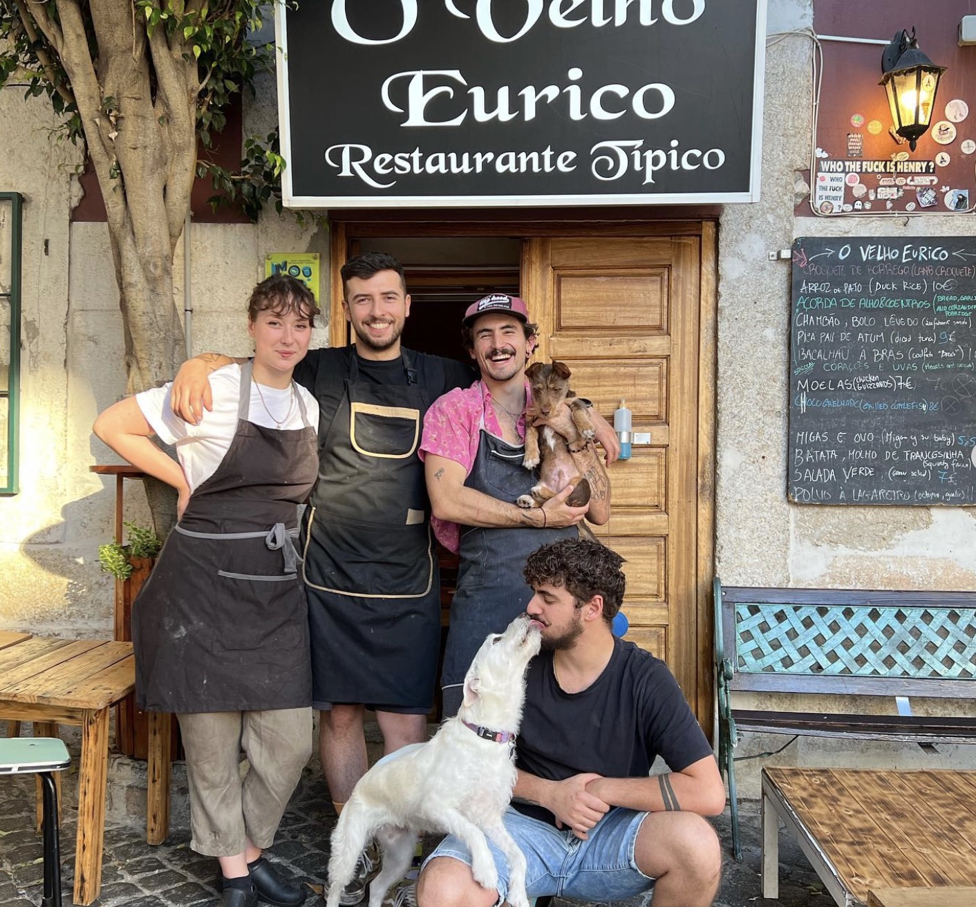 lisbon-restaurants-tascas Diego A. Rodriguez et al. sitting on a bench with a dog