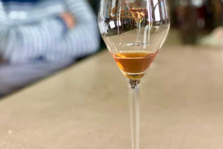 an empty wine glass sitting on a table