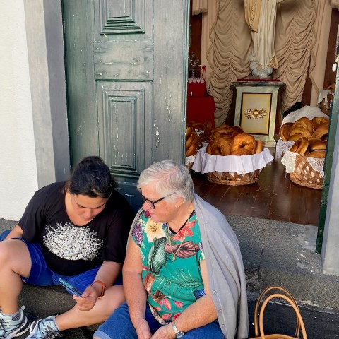 a man and a woman sitting on a bench