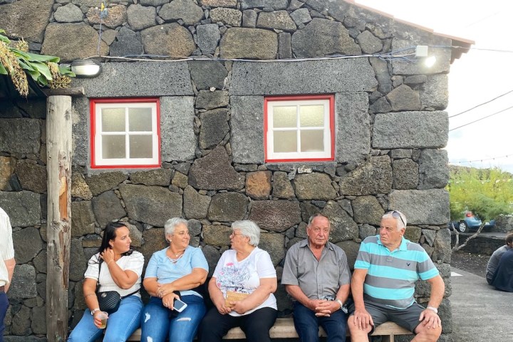 a group of people standing in front of a building